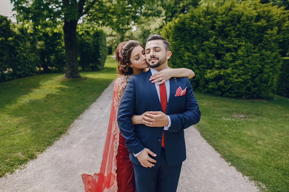 Romantic couple exchanging rings during their engagement, captured by DesignInfo Photography