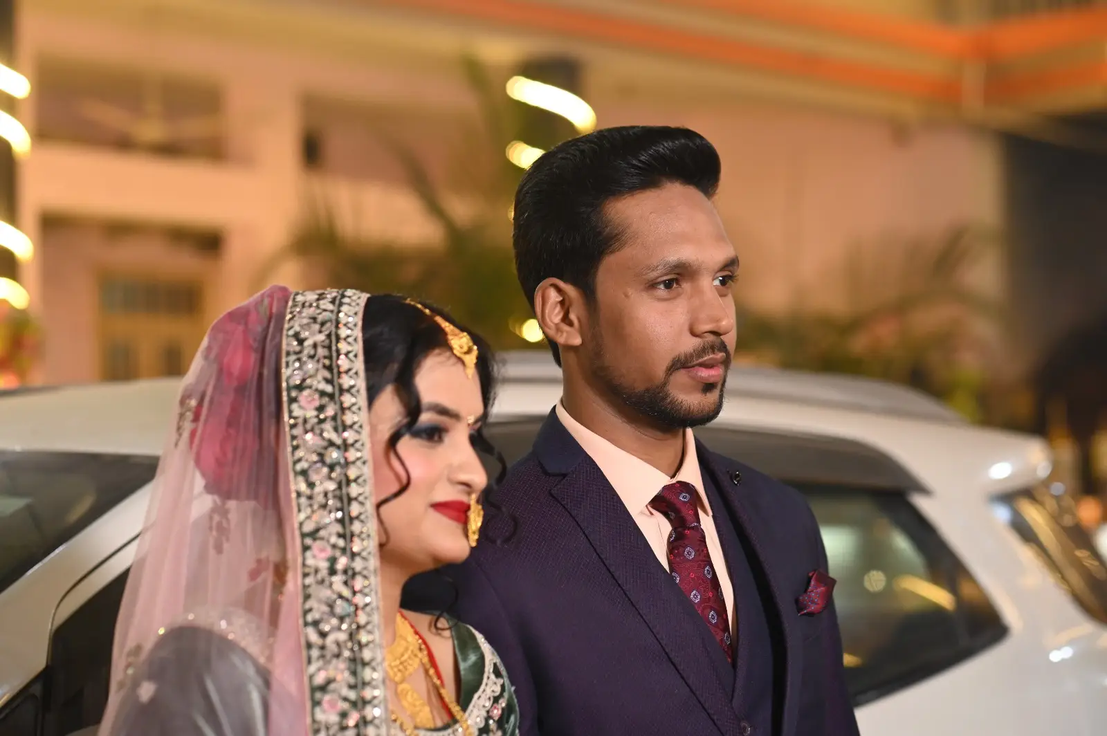 Romantic couple exchanging rings during their engagement, captured by DesignInfo Photography.