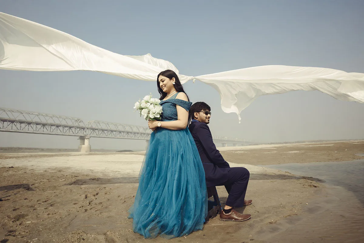 Pre-wedding photography in Patna, Delhi, Hajipur, Gaya | Romantic couple pre-wedding shoot by the river with white veil | Best pre-wedding cinematography for couples | Dreamy outdoor couple photoshoot with professional photographer.